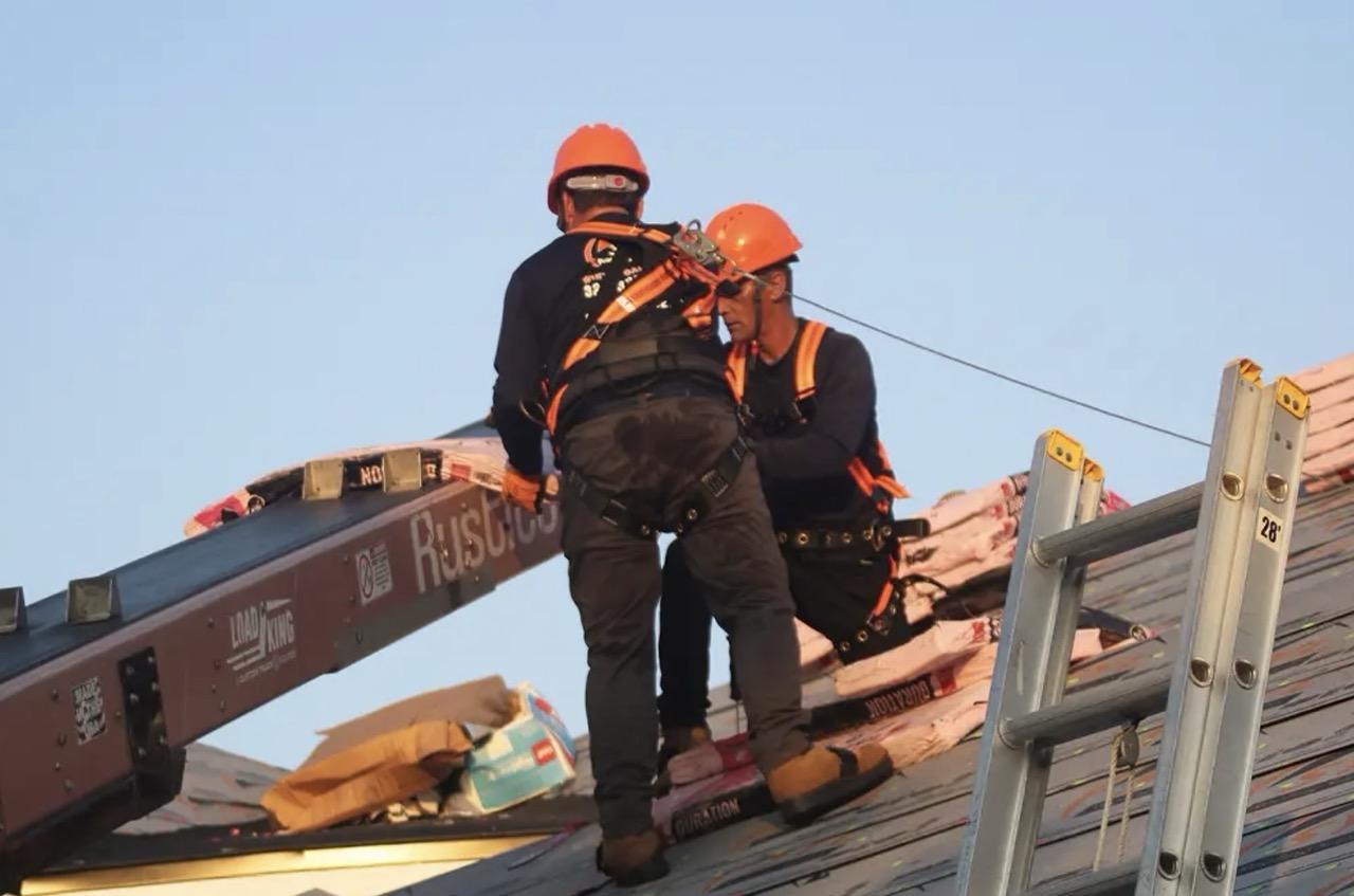 Roofing Supply in Florida Featured Image Men on Roof working using Roofing Supplies Large